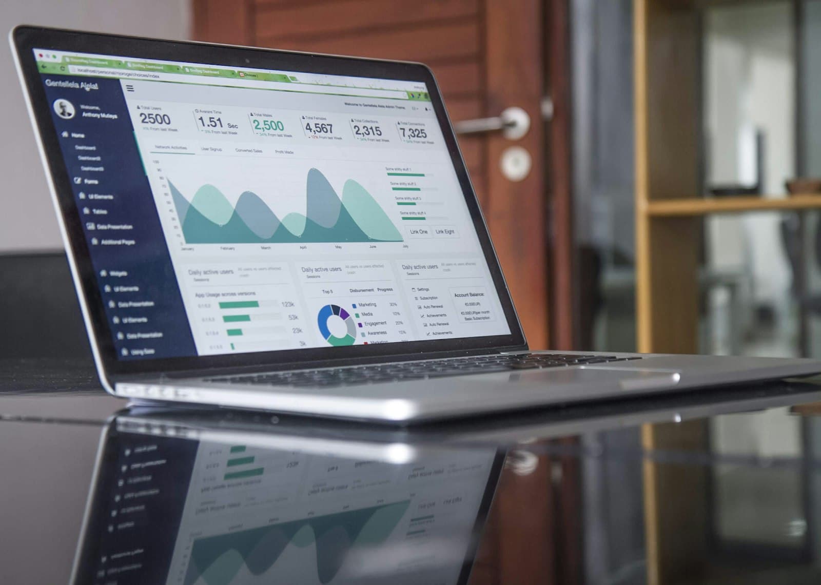 Person tracking financial growth on charts and documents representing net worth tracking over time